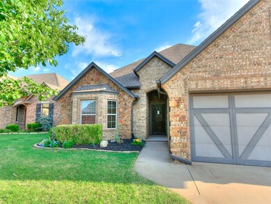 View of front facade featuring roof with shingles, a front yard, an attached garage, driveway, and stone siding