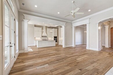 View of the den into the kitchen, dining room and