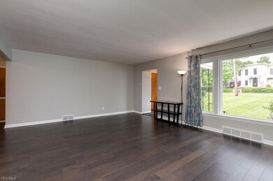 Large picture window bathes the living area in gor