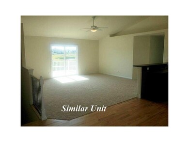 Living Room. Picture is of Similar Unit.