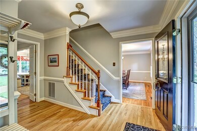 Gleaming wood floors and heavy moldings greet you