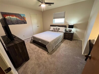 Bedroom with a textured ceiling, a closet, ceiling