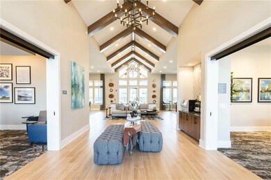 Living room with an inviting chandelier, light har