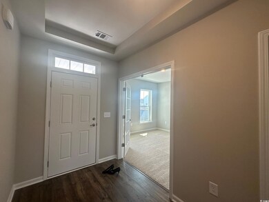 Entryway featuring hardwood / wood-style flooring,