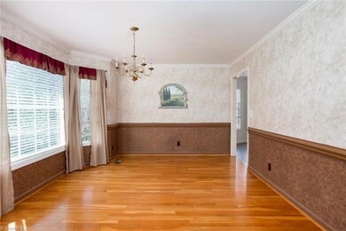 Dining room is framed with crown and chair molding.