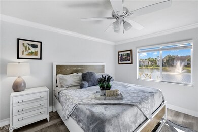 Primary bedroom featuring crown molding and water