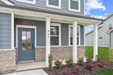 Covered front porch, ready for your personal touch.