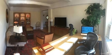 Office space featuring beamed ceiling