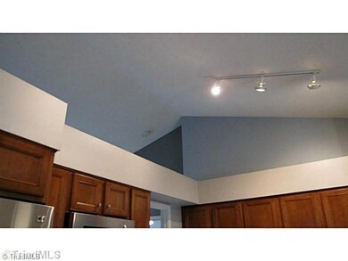 Kitchen. Cathedral ceilings in kitchen and living areas.