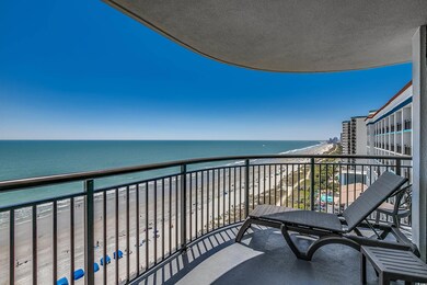 Balcony with a beach view and a water view