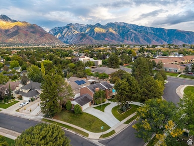 Aerial view of residential area featuring a mountain backdrop
