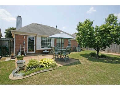 Lovely patio overlooking fenced in backyard.