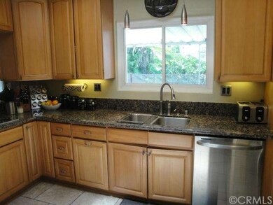 Newer cabinets with granite countertops.