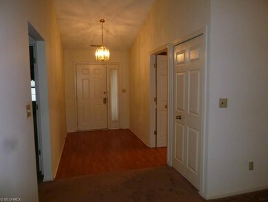 Open foyer leading into spacious kitchen with sepa