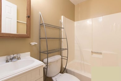 Full bathroom featuring shower / washtub combination and vanity