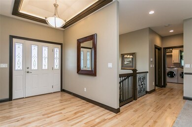 Welcoming Foyer with Tray ceiling accented with li