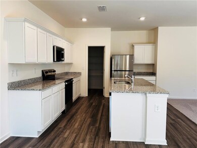 Kitchen featuring stainless steel appliances, a ki