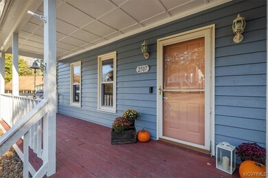 Doorway to property with covered porch