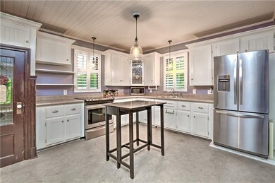 The spacious kitchen features modern touches such 