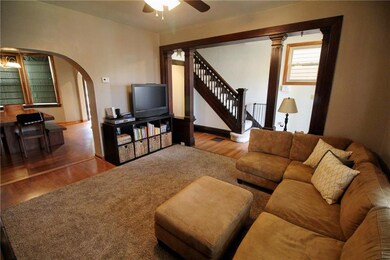 Living room, main entrance to right  and dining ro