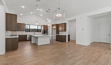 Kitchen & dining area with vaulted ceiling