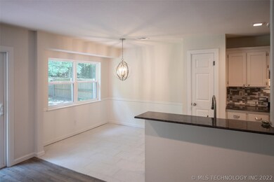 Kitchen/breakfast nook open to the living area