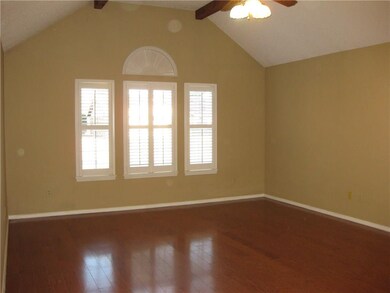 Another view of living room with beautiful windows