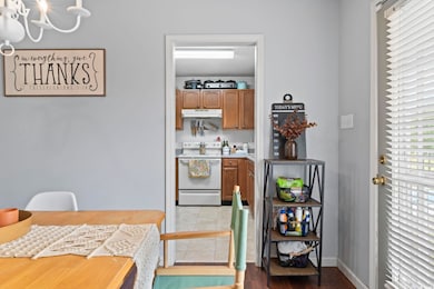 Interior space featuring baseboards and a chandelier