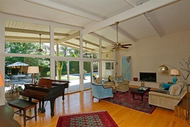 Floor to ceiling solar tinted windows, vaulted bea