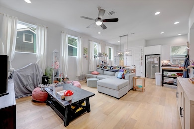 Living room featuring light wood finished floors,