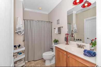 Full bath with a shower with shower curtain, toile
