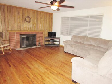 The Brick Wood Burning Fireplace has a New Door to