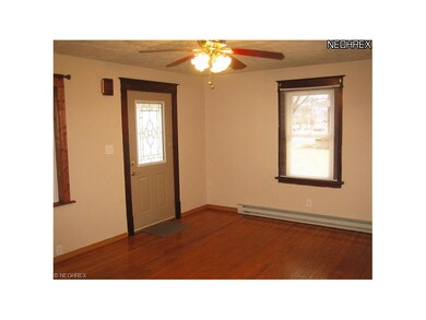 There is hardwood flooring in the living room + th