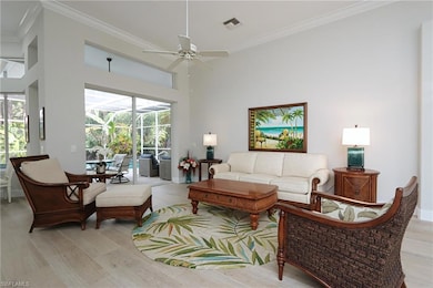 Living room featuring a towering ceiling, ornament