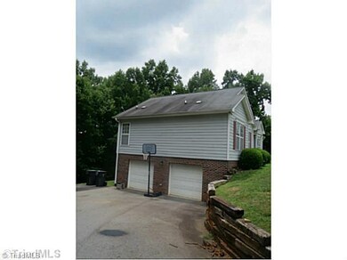 Parking Lot/Garage. Nice paved drive with two car garage.