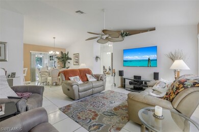 Nice open living room with big ceiling fan, there are 6 fans total throughout the home.