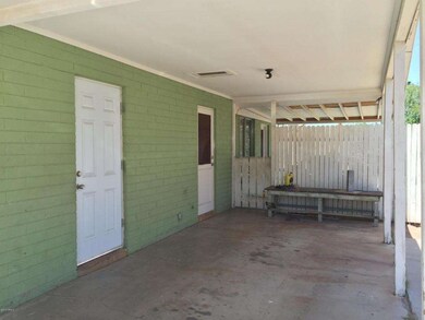 CARPORT * ENTRANCE TO KITCHEN & LAUNDRY