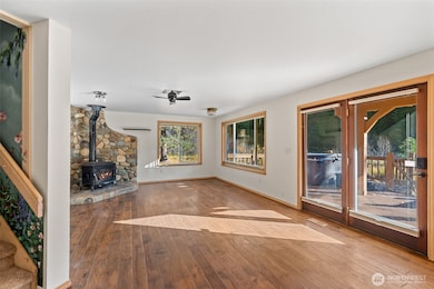 Gorgeous river rock wood burning stove heats the home easily