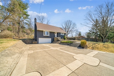 Extra-large driveway fits up to 9 cars.