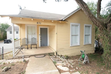 View of front of home featuring a shingled roof