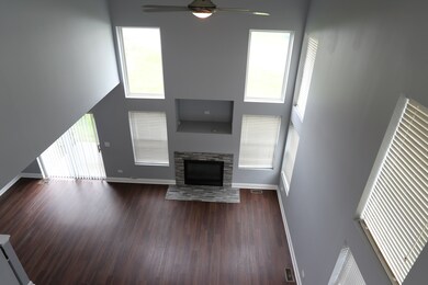 Gas fireplace with stone surround and space for yo