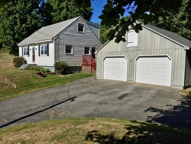 Two car garage with lots of upper...