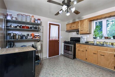 Spacious kitchen with lighted ceiling fan, newer g