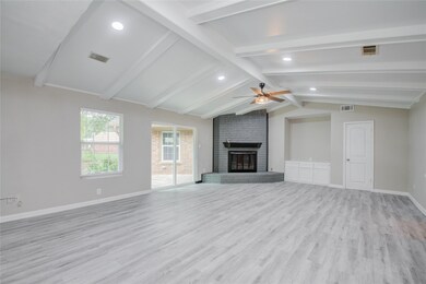 Fully upgraded Family Room with Fireplace, vinyl flooring, LED lights, custom fan