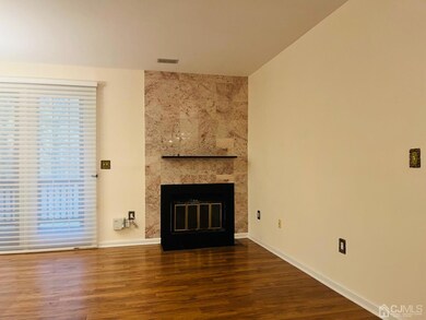 wood burning fireplace with marble surround
