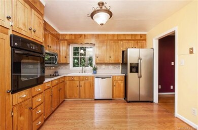Kitchen is well-equipped with wall oven, new stain