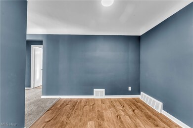 Spare room featuring carpet