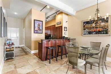 View of breakfast bar, front entrance, dining area