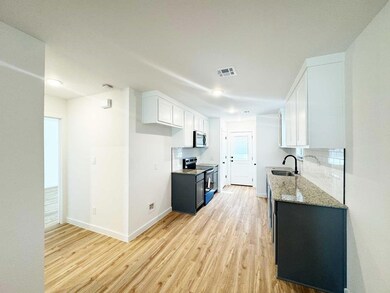 Kitchen with appliances with stainless steel finis