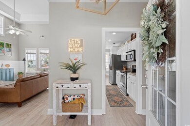 Interior space with stainless steel appliances, a healthy amount of sunlight, and light wood finished floors